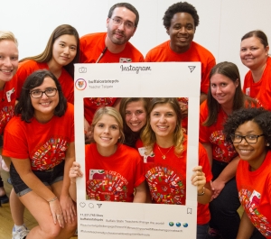 group of students in orange tshirts