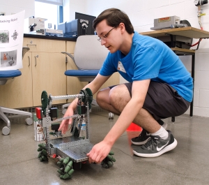 Student with a robot