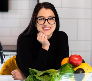 Woman with a bowl of produce